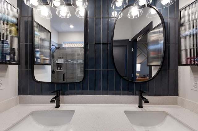 bathroom with a shower and vanity