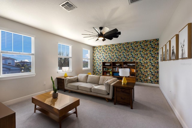 living room featuring ceiling fan and light carpet