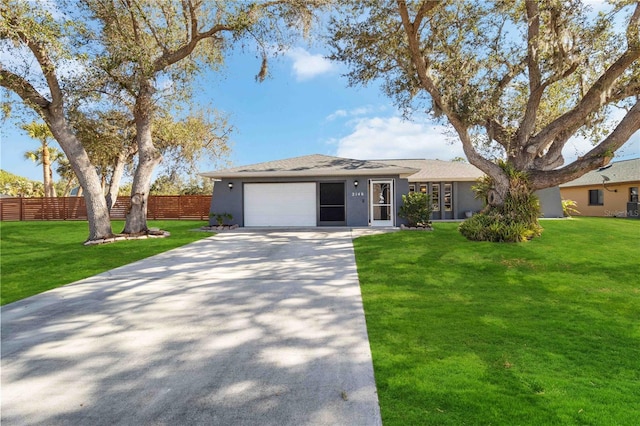 single story home featuring a front lawn and a garage