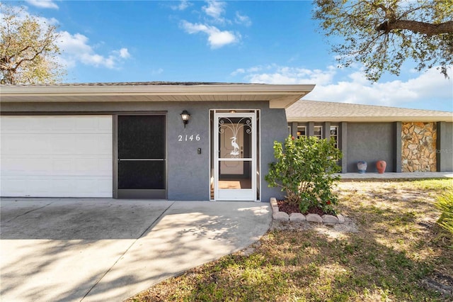 view of exterior entry featuring a garage