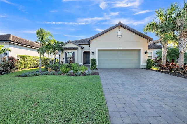 view of front facade with a front lawn and a garage