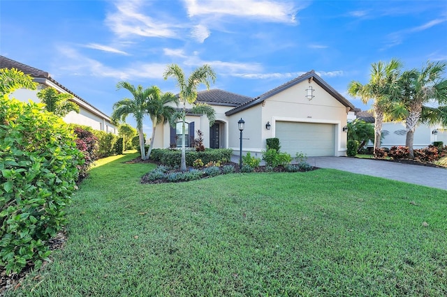 view of front of house featuring a front lawn and a garage