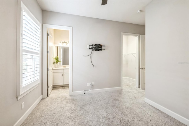 unfurnished room featuring light colored carpet