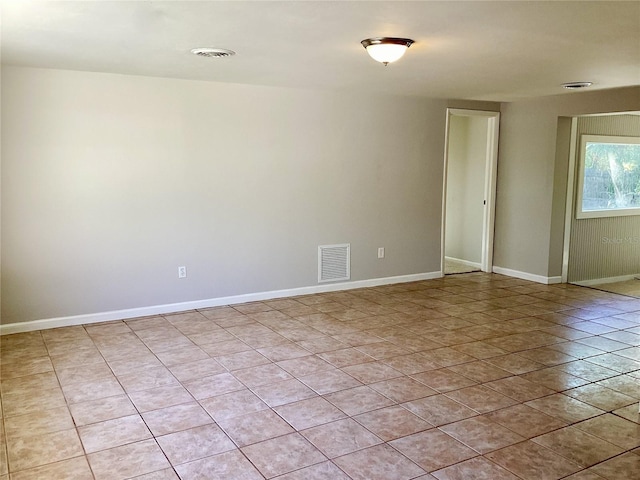 spare room featuring light tile patterned floors