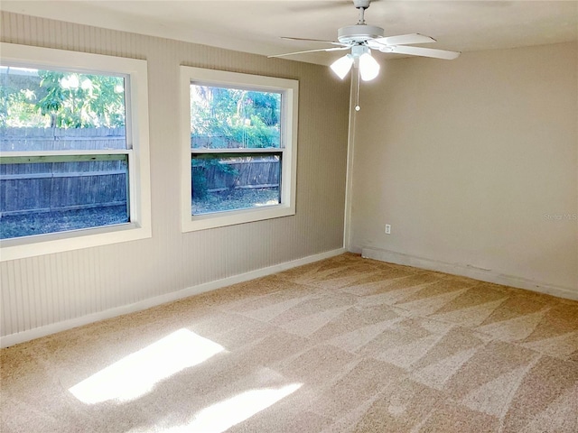 carpeted empty room with ceiling fan