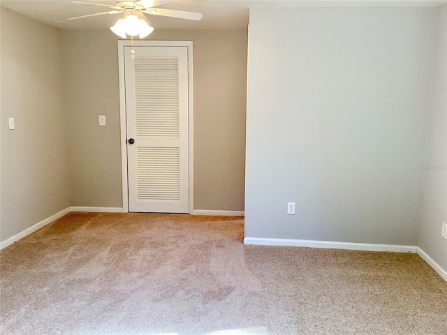 empty room with carpet and ceiling fan