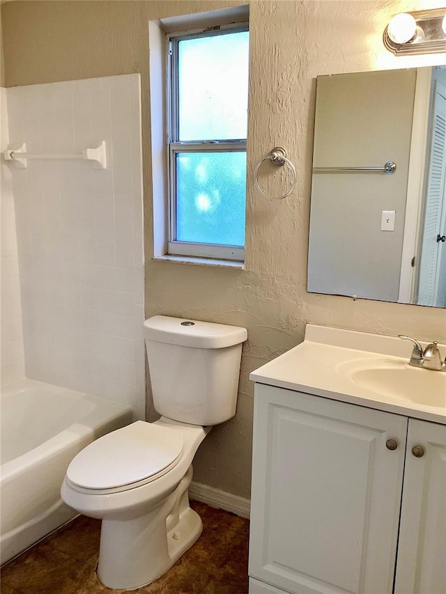 full bathroom featuring vanity, shower / bath combination, and toilet