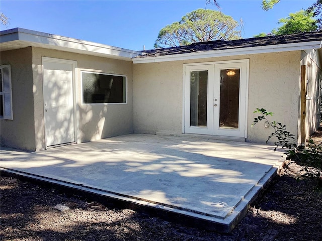 back of property with french doors and a patio