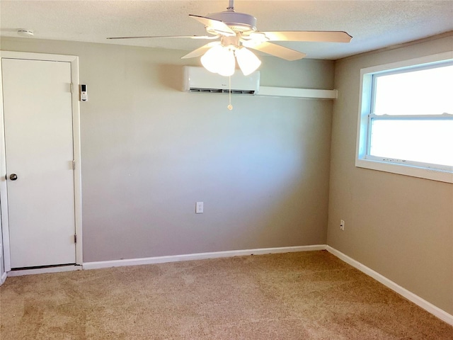 carpeted empty room featuring a wall mounted air conditioner and ceiling fan