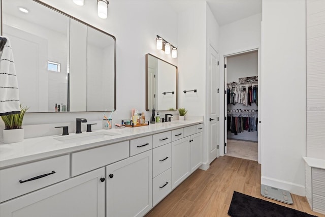 bathroom with vanity and hardwood / wood-style floors