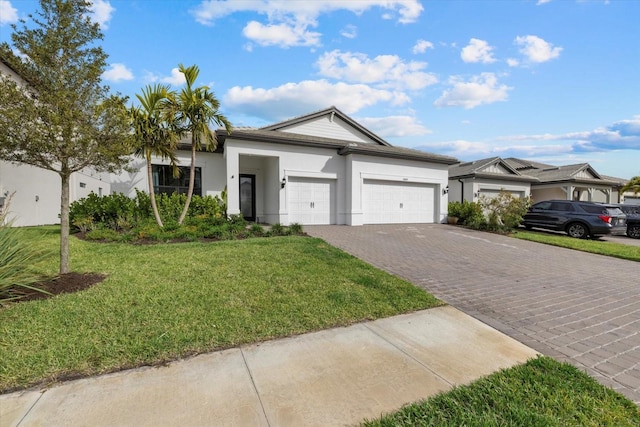 single story home with a front lawn and a garage