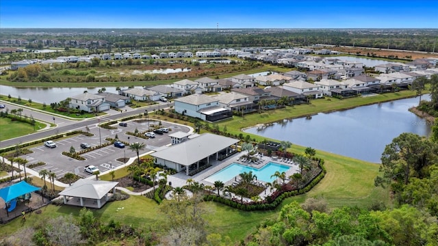 birds eye view of property with a water view