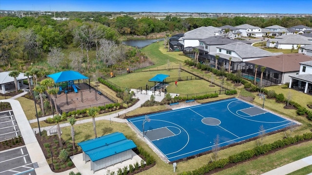 view of basketball court featuring a playground