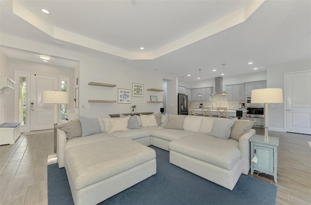 living room with a raised ceiling