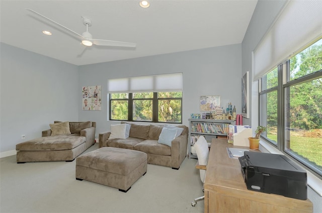 living room featuring carpet floors and ceiling fan