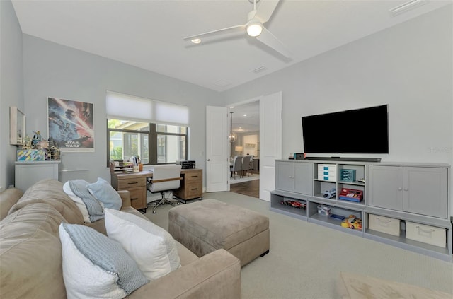 living room with carpet floors and ceiling fan