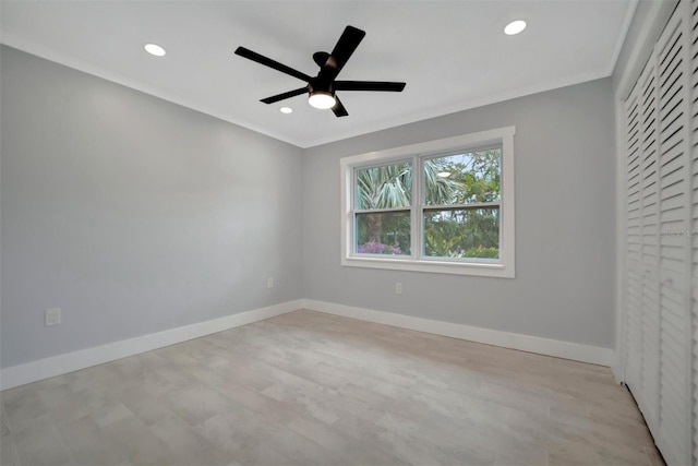 empty room with ceiling fan and ornamental molding