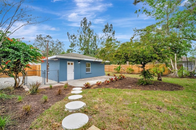 view of outdoor structure featuring a lawn