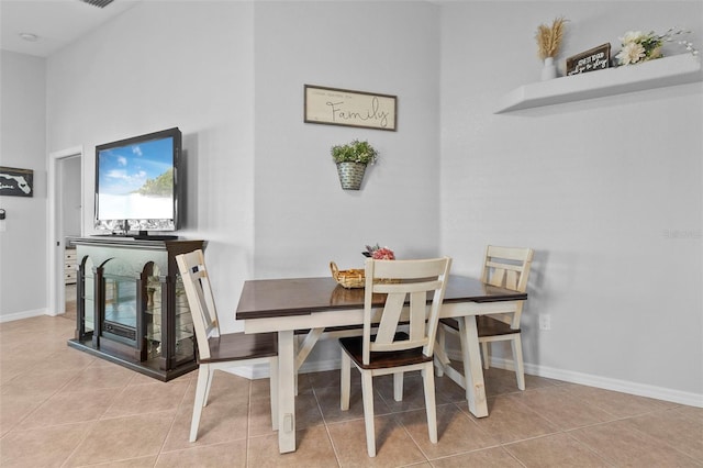 dining area with light tile patterned flooring