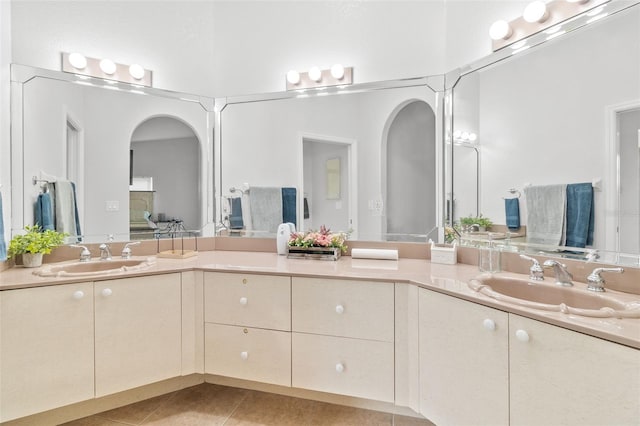 bathroom featuring tile patterned flooring and vanity