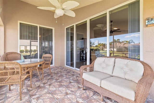 sunroom / solarium with ceiling fan