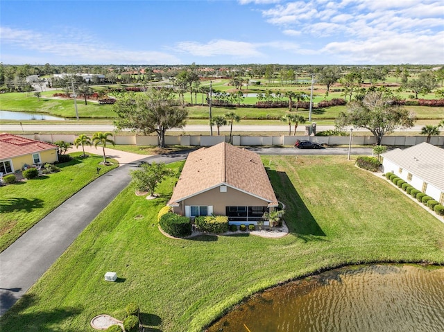 drone / aerial view with a water view