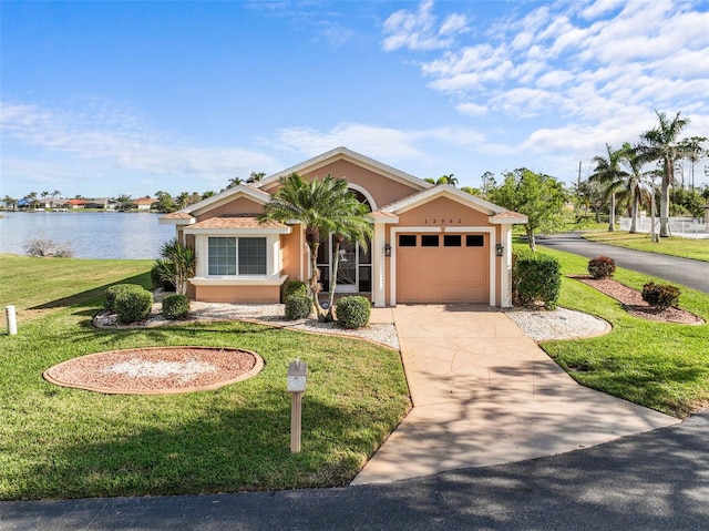 view of front facade featuring a water view and a front yard