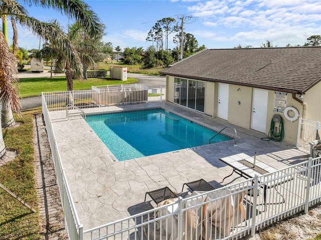 view of swimming pool with a patio area