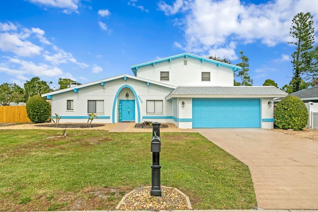 view of front of house featuring a front yard and a garage