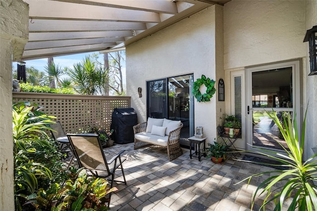 view of patio featuring a pergola and area for grilling