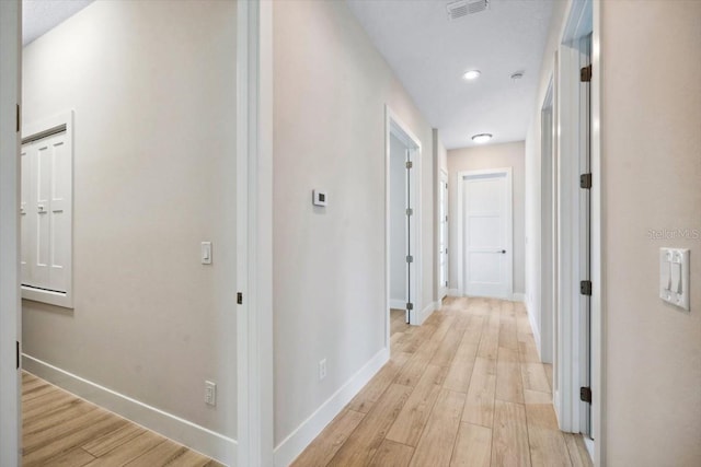 hallway with light wood-type flooring