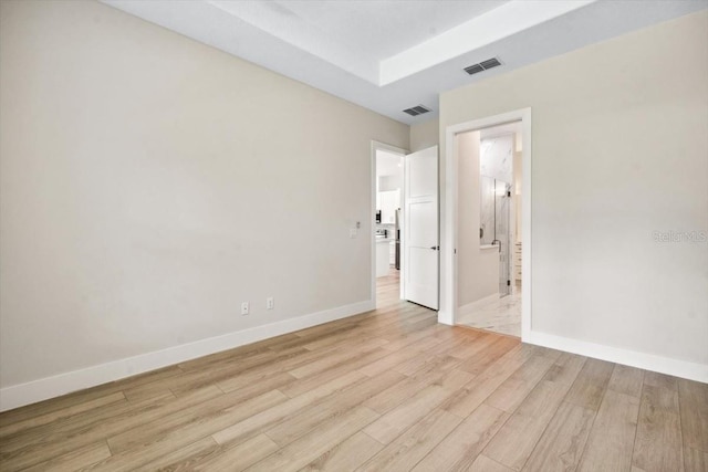 unfurnished room with light hardwood / wood-style floors