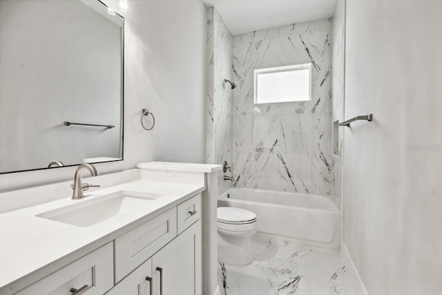 full bathroom featuring vanity, tiled shower / bath combo, and toilet