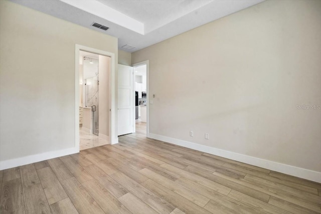 unfurnished room with light wood-type flooring