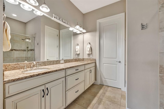 bathroom featuring tile patterned floors, vanity, and an enclosed shower