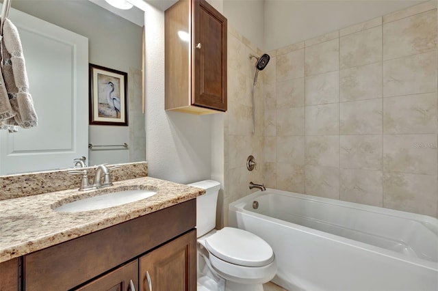 full bathroom with vanity, toilet, and tiled shower / bath combo