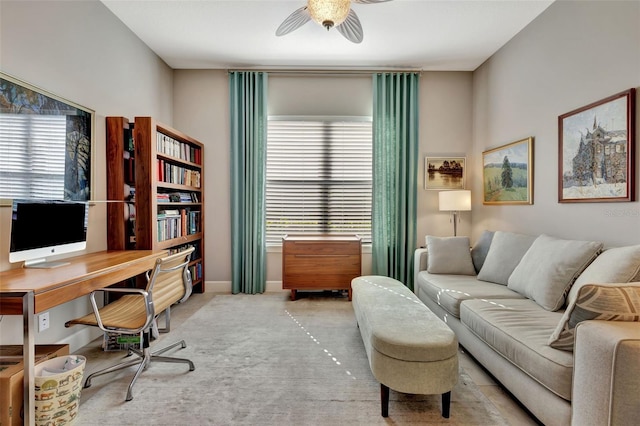 carpeted office featuring ceiling fan and a wealth of natural light