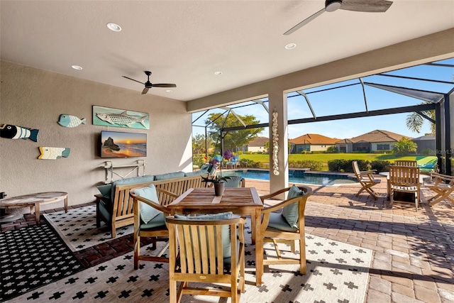 exterior space featuring ceiling fan and glass enclosure