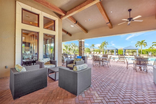 view of patio / terrace with a gazebo, an outdoor hangout area, and ceiling fan