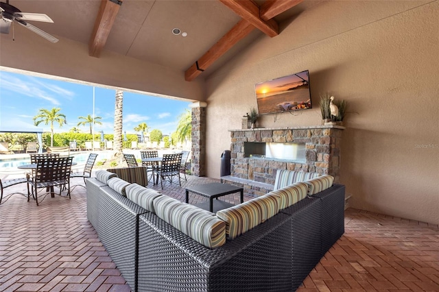 view of patio featuring an outdoor living space with a fireplace