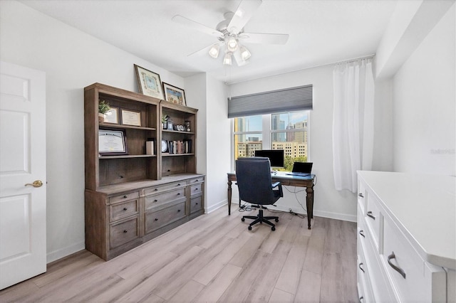 office space featuring light wood-type flooring and ceiling fan