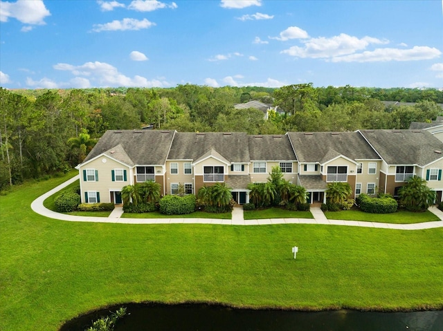 birds eye view of property with a water view