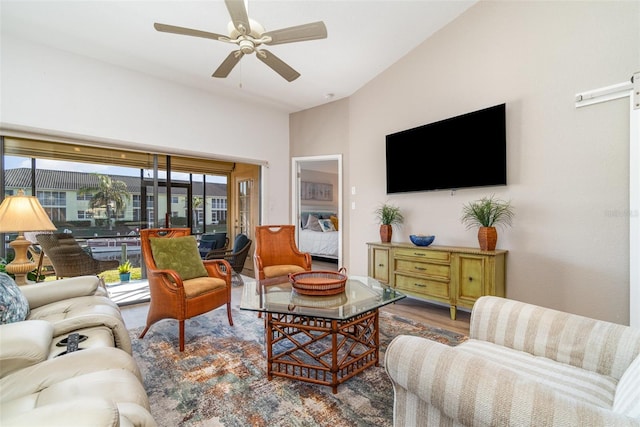 living room featuring ceiling fan and hardwood / wood-style flooring