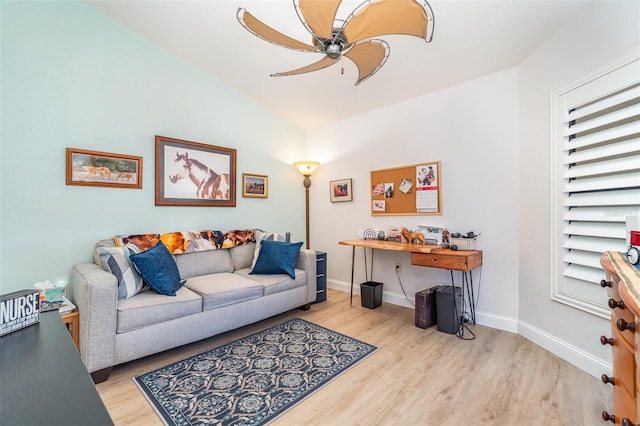 living room with ceiling fan and light hardwood / wood-style floors