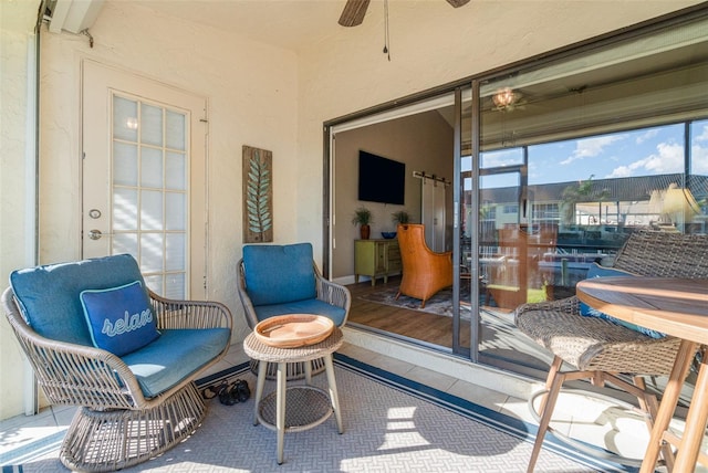 sunroom / solarium with ceiling fan