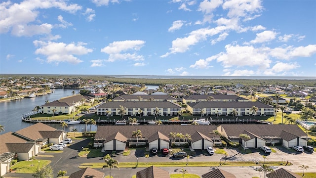 drone / aerial view with a water view