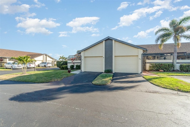 ranch-style home featuring a garage