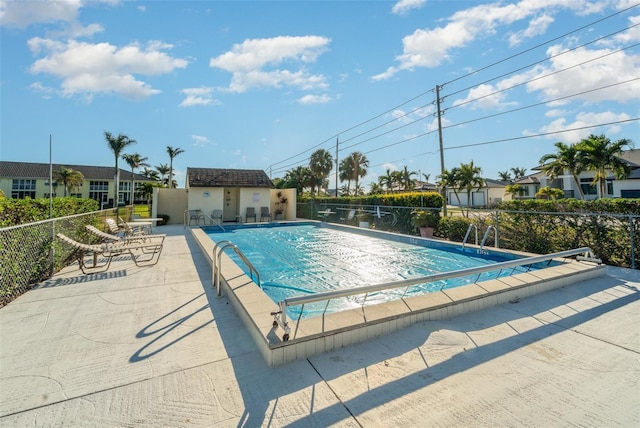 view of swimming pool featuring a patio area