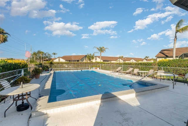 view of swimming pool with a patio