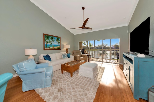 living room featuring ceiling fan, light hardwood / wood-style floors, and vaulted ceiling